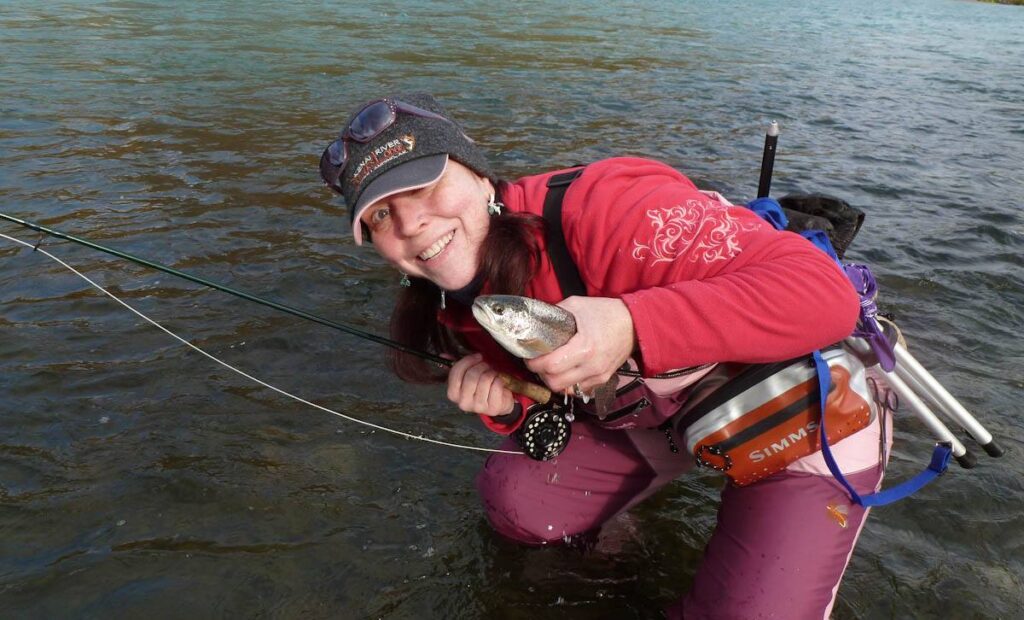 francesca-phw-alaska-participant-naps-her-first-rainbow-trout-of-the-day-near-the-confluance-of-the-kenai-and-russian-rivers