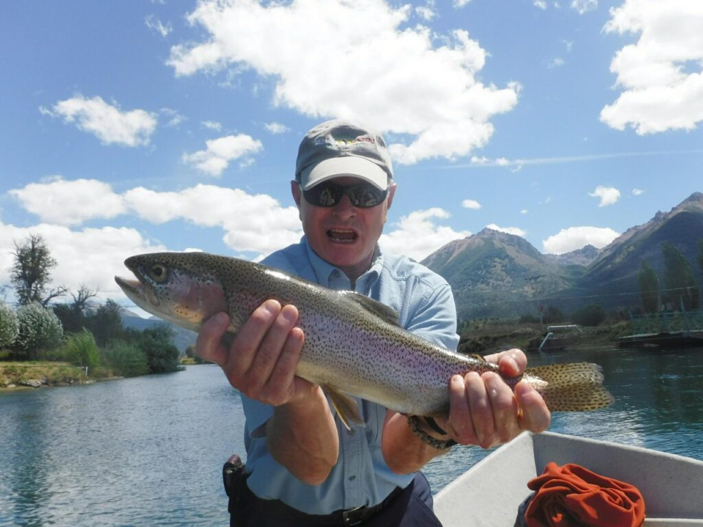 Raymond with a BIG rainbow trout!