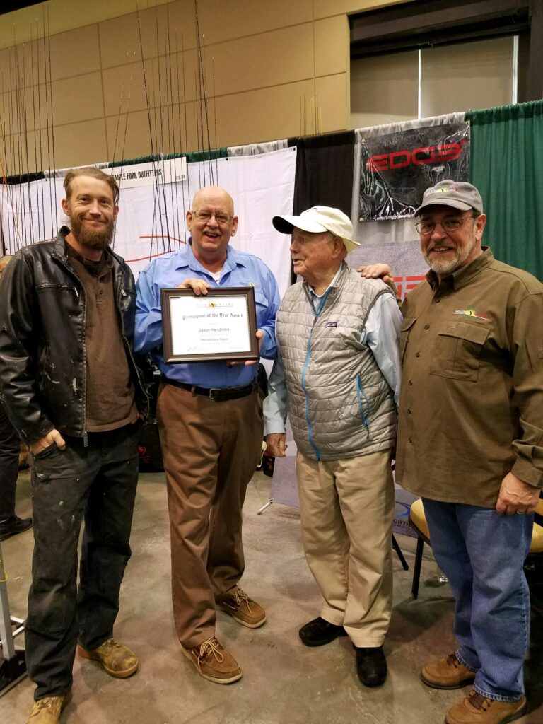 Jason Hendricks being presented with the "2016 Participant of the Year Award" for the PA Region. Pictured are Jason Hendricks, Skip Hughes, Lefty Kreh, and Tom Herr