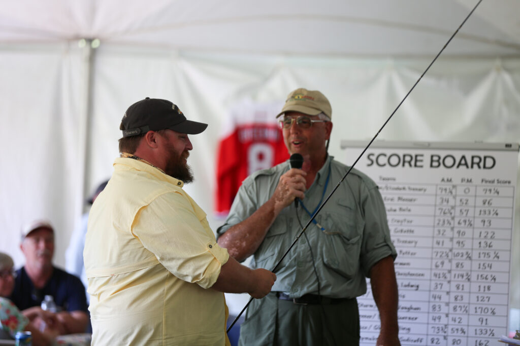 SSG (ret) James Scott, U.S. Army receives a custom bamboo fly rod from Henry Bowser (winner of the 2017 Spirit of the Mossy Creek Invitational award)