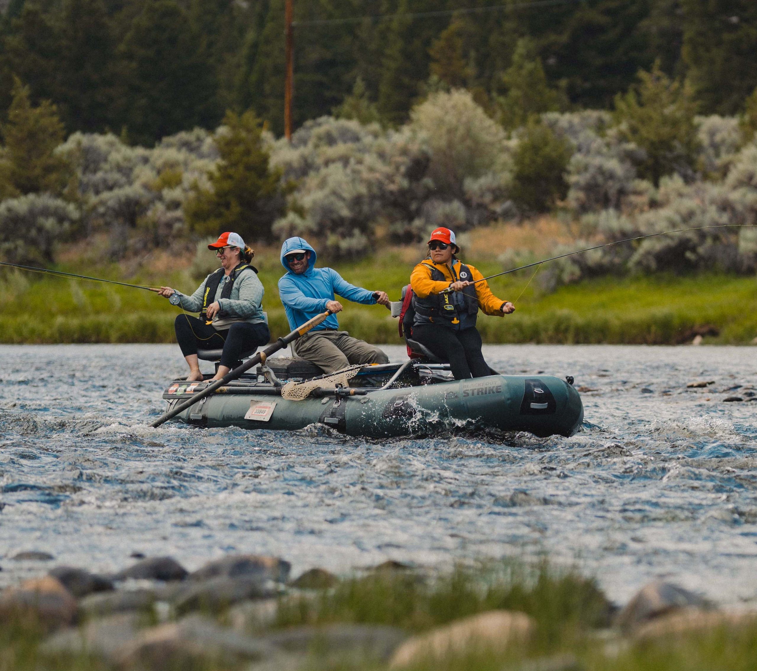 Centered variation of two female Veteran participants fly fishing the Big Hole River out of Freedom Ranch