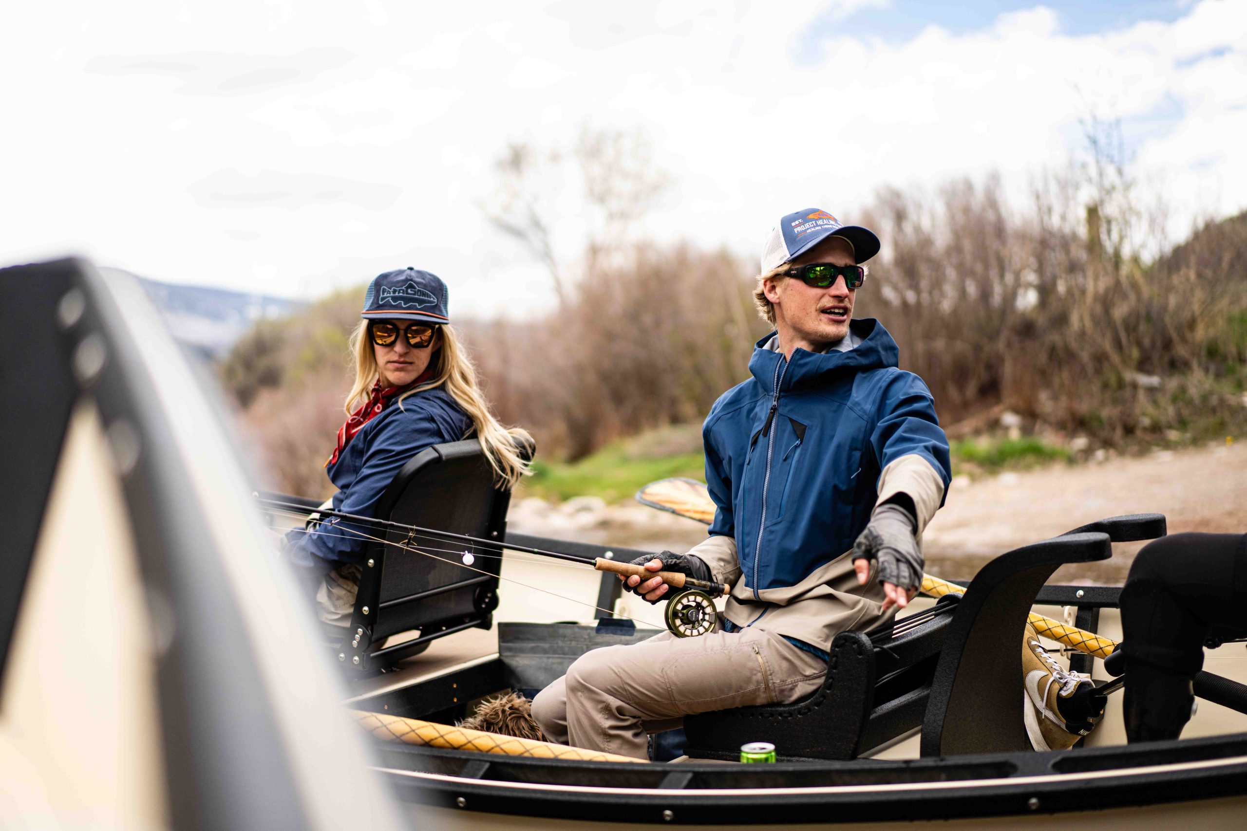 Two Anglers Rig Up In A Drift Boat